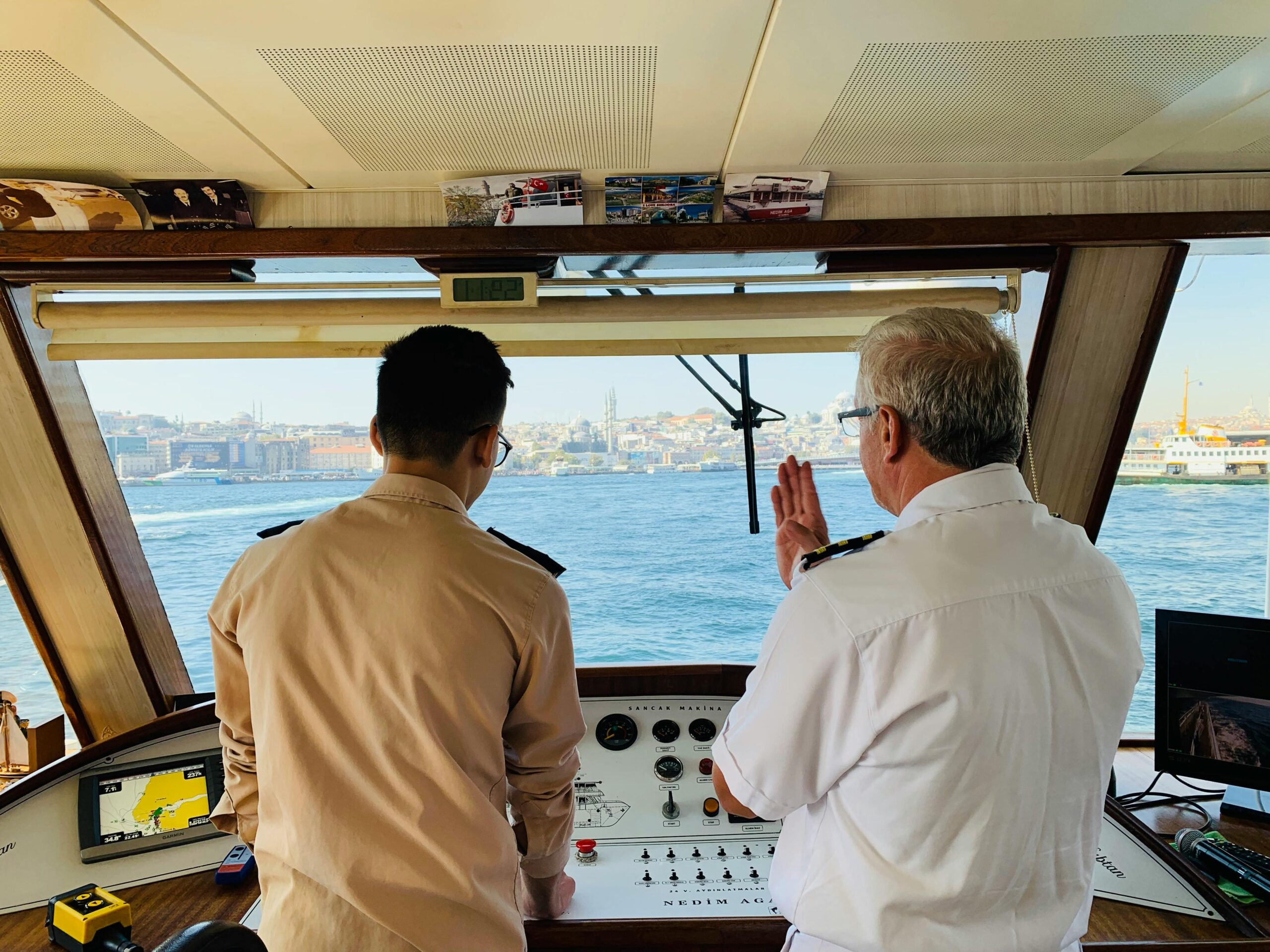 Two captains steering a cruise ship