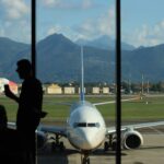 Ryanair flight from Bergamo airport in Italy. Ryanair leveraging network connectivity. There is uncertainty in air travel amid Ryanair's French routes cuts and airfare tax hikes.