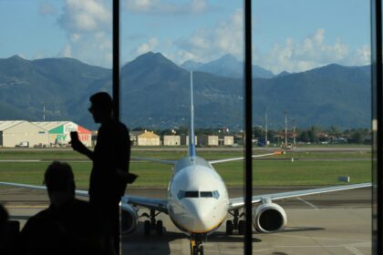 Ryanair flight from Bergamo airport in Italy. Ryanair leveraging network connectivity. There is uncertainty in air travel amid Ryanair's French routes cuts and airfare tax hikes.