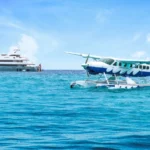 Yacht on water with a seaplane