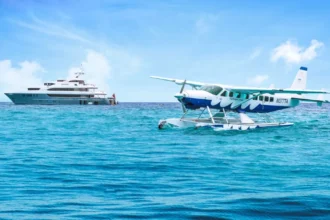Yacht on water with a seaplane