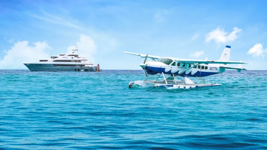 Yacht on water with a seaplane