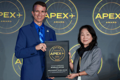 Jessica Lin, STARLUX Airlines Director of Airport Operations, stands beside a man in a blue suit holding a plaque that reads “APEX Five Star Global Airline 2026” at the Long Beach Convention Centre.