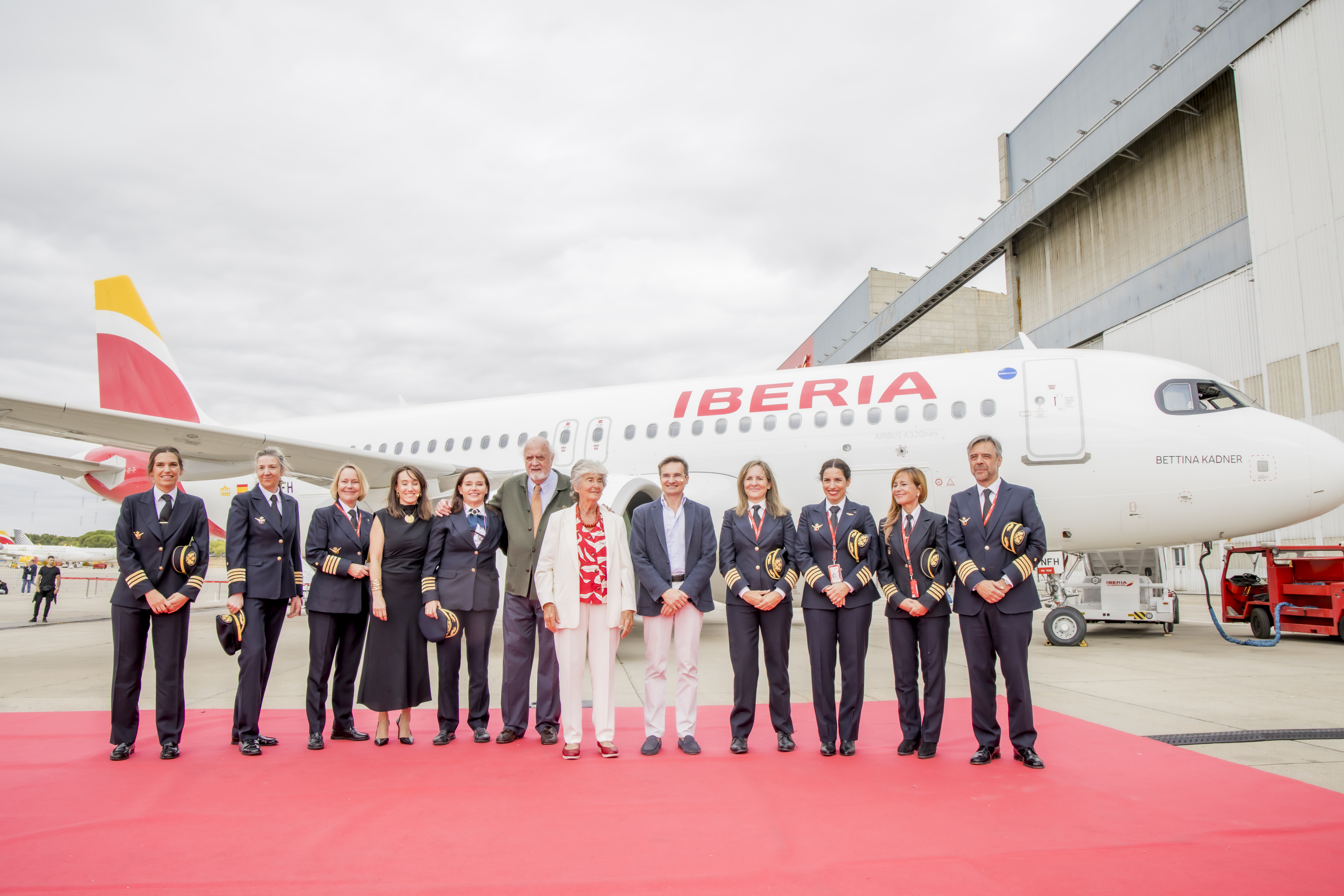 Iberia staff in front of the new plane named after Bettina Kadner.