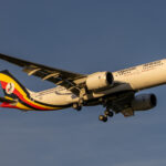 Uganda Airlines Airbus A330neo in flight against blue sky, representing the Air India Uganda Airlines partnership and expanding Africa Asia air connectivity 2025 under the Uganda Airlines Air India interline agreement.