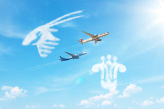 Qatar and China Southern Airline Planes with clouds of their logo's shapes.