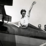 Louise Thaden, waving aboard an aircraft