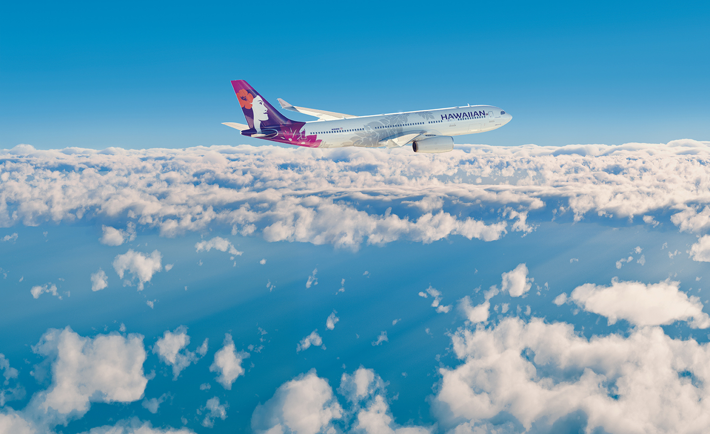 Hawaiian Airlines aircraft flying above the clouds, representing sustainable aviation fuel flights on international routes.