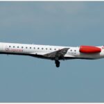 A Loganair flight, with its iconic tartan tail, takes off from Manchester airport.