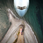 Cathay Pacific aircraft over a coast