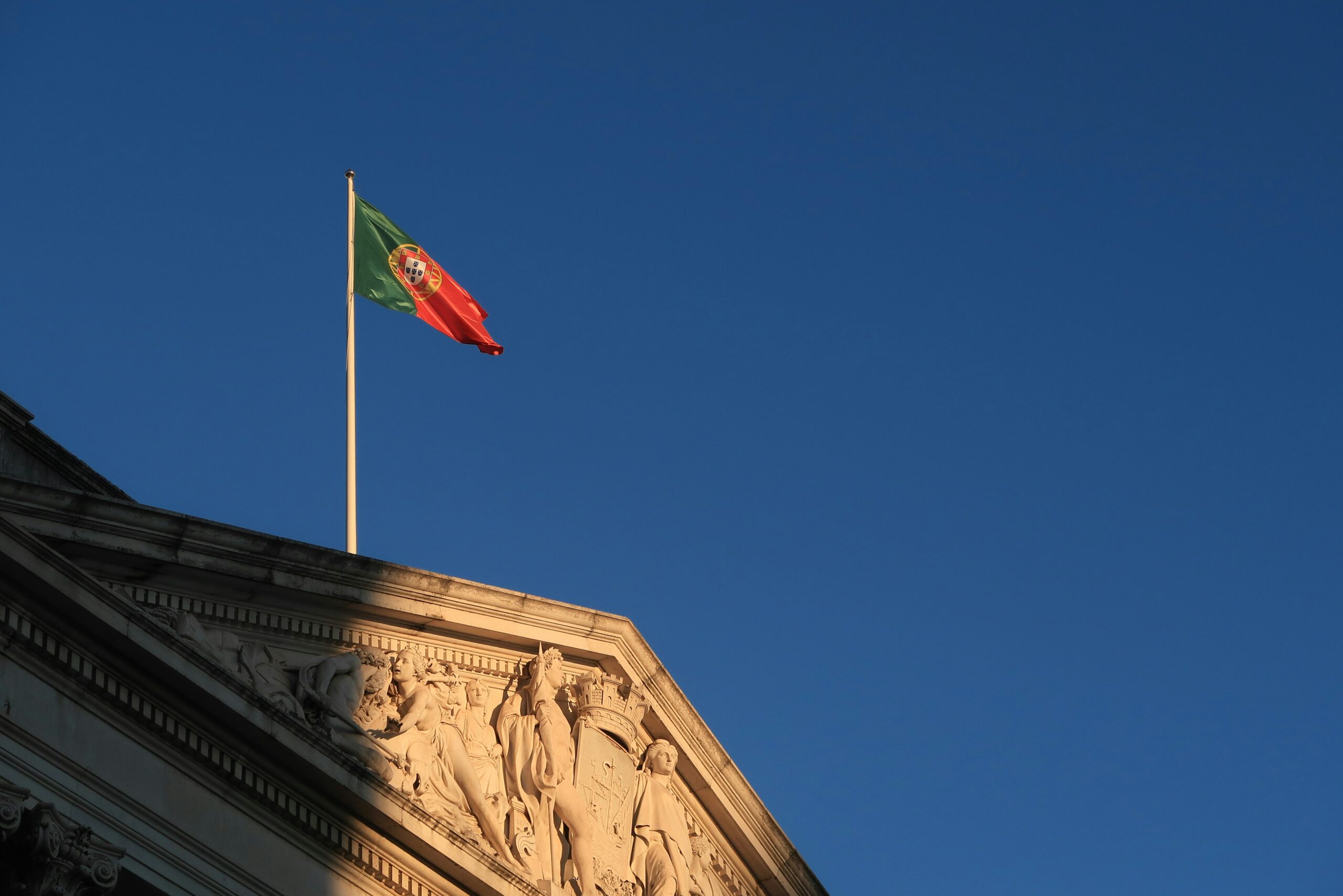 Portuguese flag on top of a building 