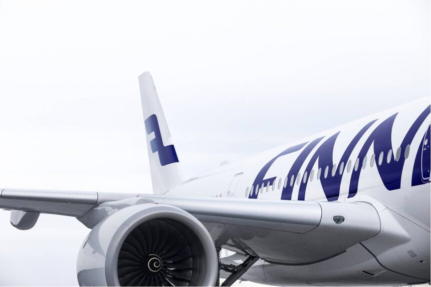 Finnair aircraft close-up showing engine, fuselage and tail logo, reflecting Finnair ancillary bundles and Sustainable Aviation Fuel investment strategy.