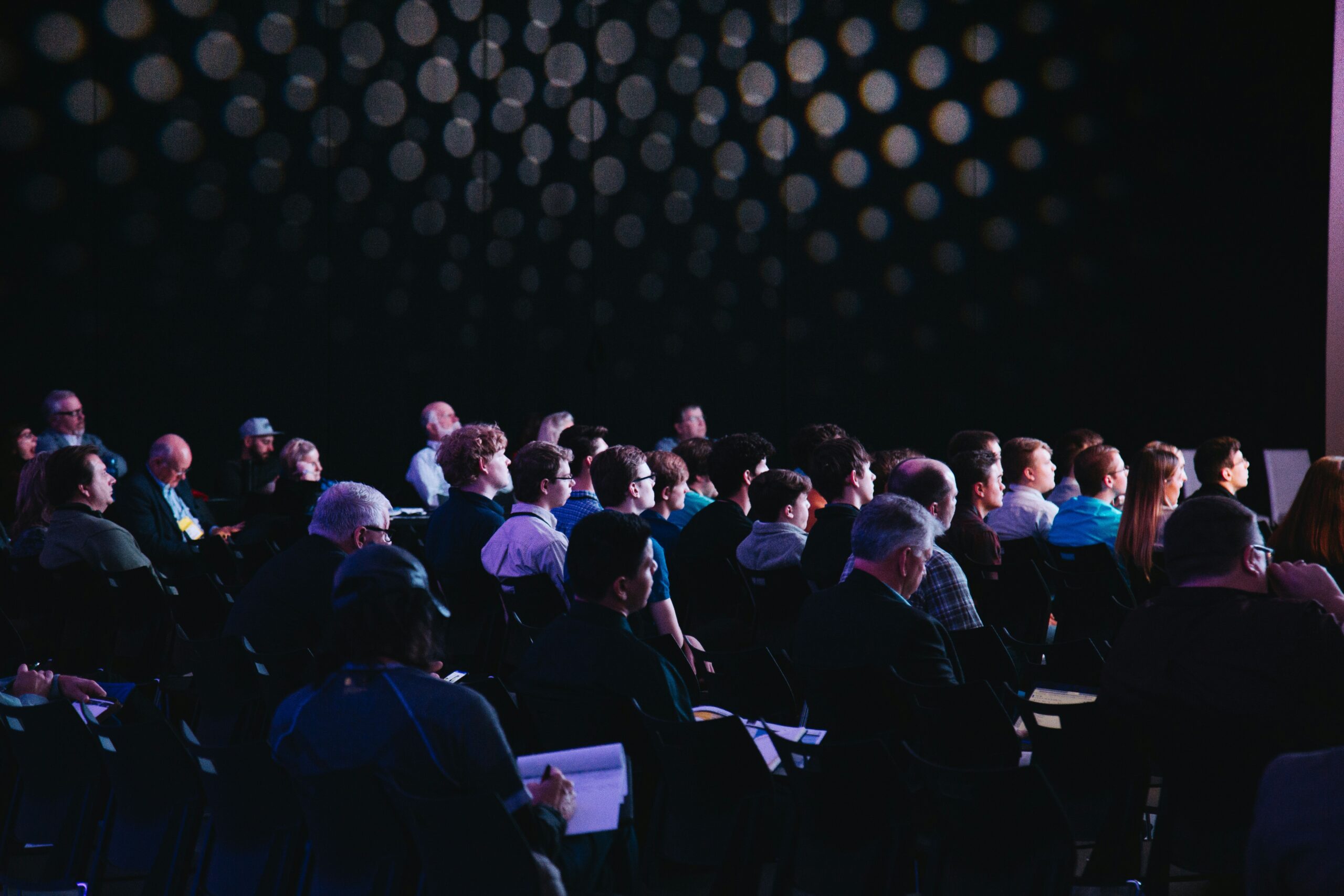 Crowd of people sitting in a conference room 