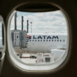 LATAM Aircraft through plane window at Aeroporto Internacional de Curitiba