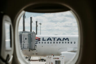 LATAM Aircraft through plane window at Aeroporto Internacional de Curitiba