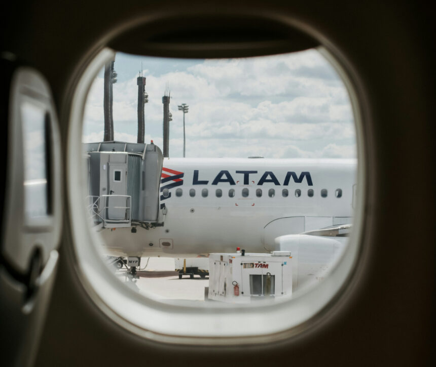 LATAM Aircraft through plane window at Aeroporto Internacional de Curitiba