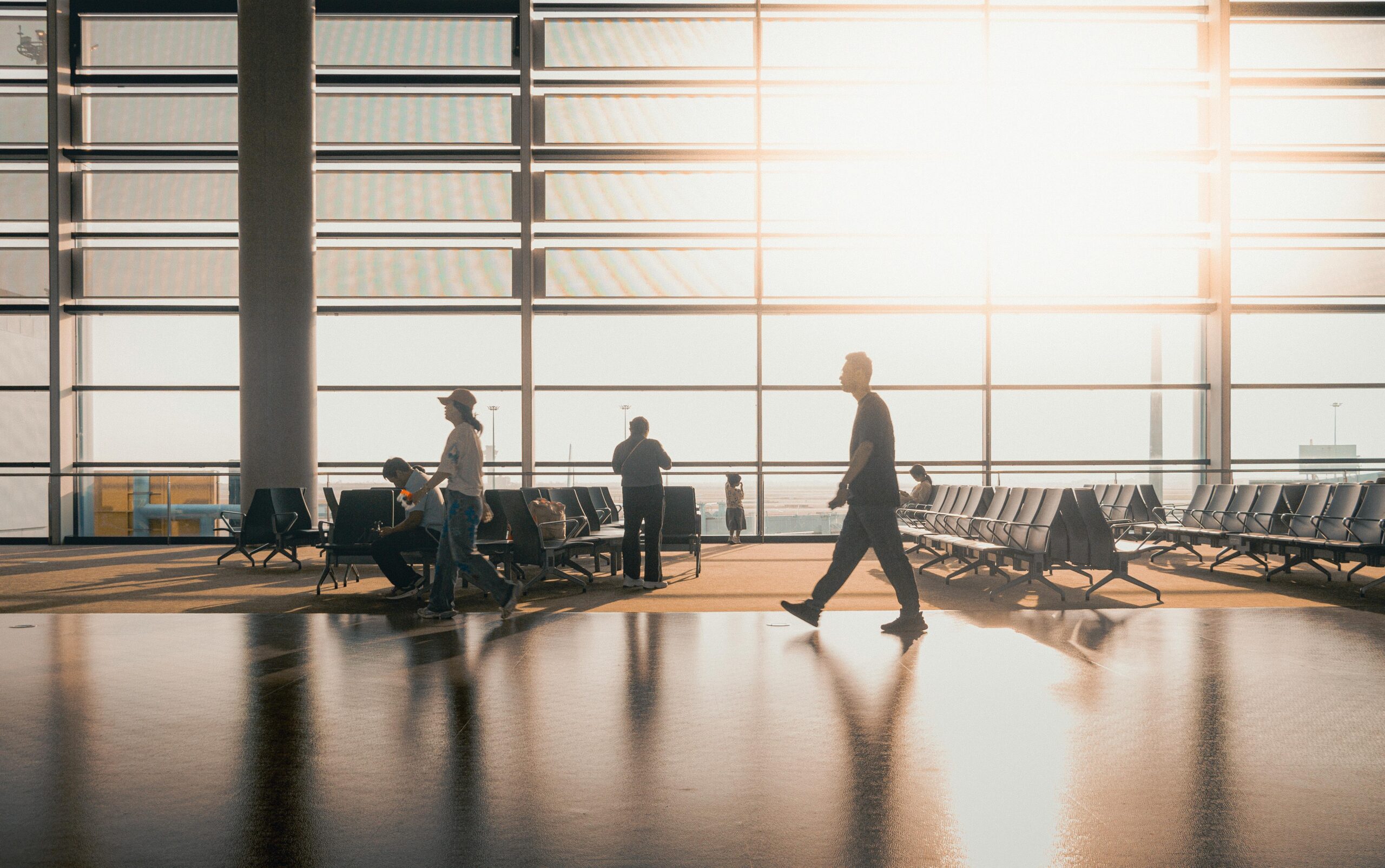 Silhouetted Travelers at Shanghai Airport Terminal