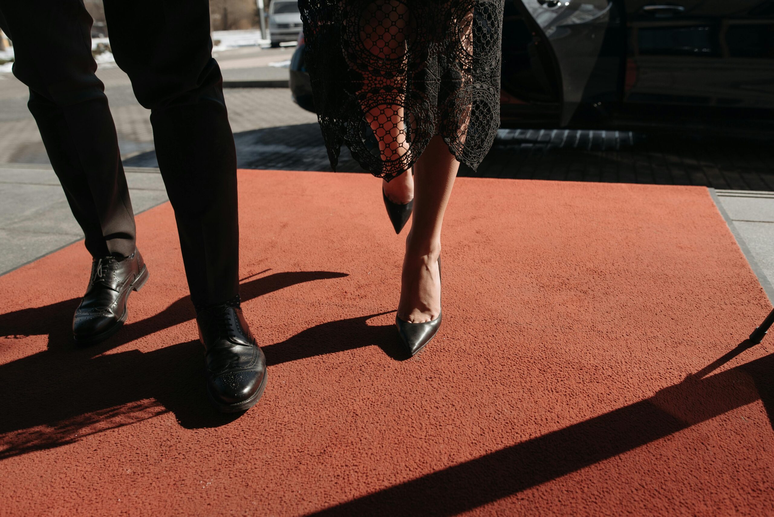 A couple waling on a red carpet