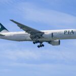 Pakistan International Airlines Boeing 777 in flight, as Pakistan International Airlines resumes UK flights 2025 after a five-year suspension.