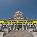 U.S. Capitol building chained off with a “Closed Until Further Notice” sign, symbolizing a government shutdown affecting Essential Air Service funding and rural air travel across the U.S.