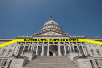 U.S. Capitol building chained off with a “Closed Until Further Notice” sign, symbolizing a government shutdown affecting Essential Air Service funding and rural air travel across the U.S.