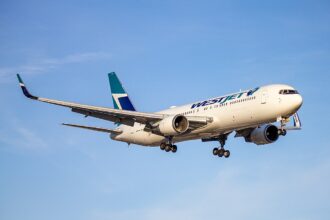 A WestJet aircraft in the air.