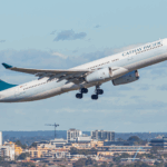 A Cathay Pacific plane takes off.