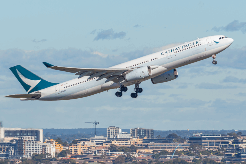 A Cathay Pacific plane takes off.