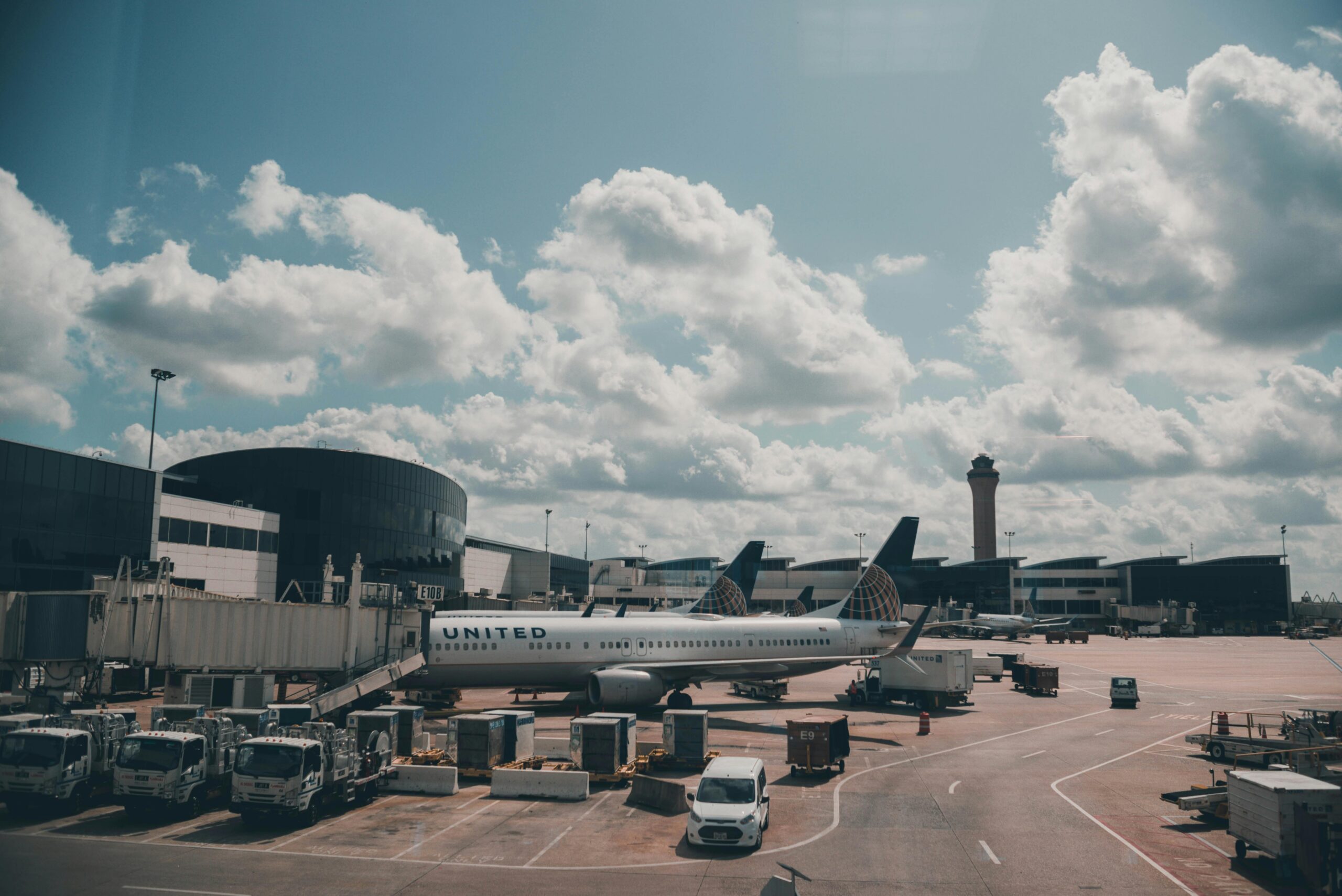 A White Airplane Parked on Airport 