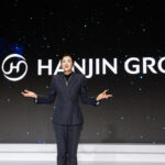 Cho in front of the new Hanjin Logo