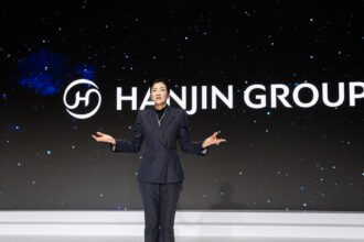Cho in front of the new Hanjin Logo