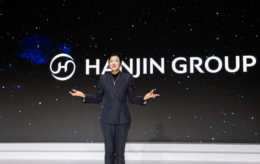 Cho in front of the new Hanjin Logo