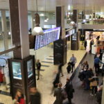 Passenger Experience walking through the lobby at the Geneva Airport.