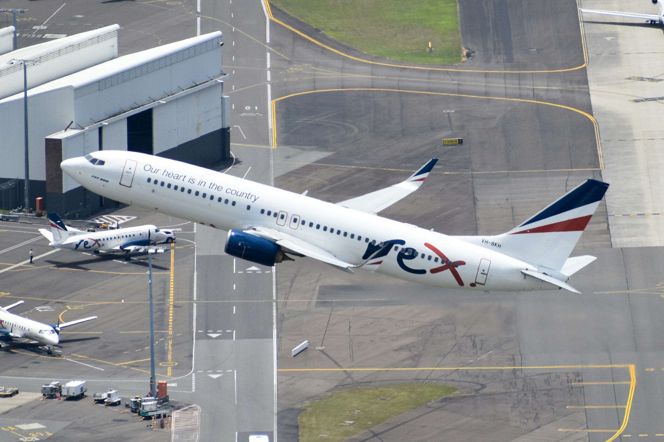 Rex 737-800 departing Sydney Airport