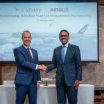 Representative from Cathay Pacific and Airbus signing the joint investment agreement.