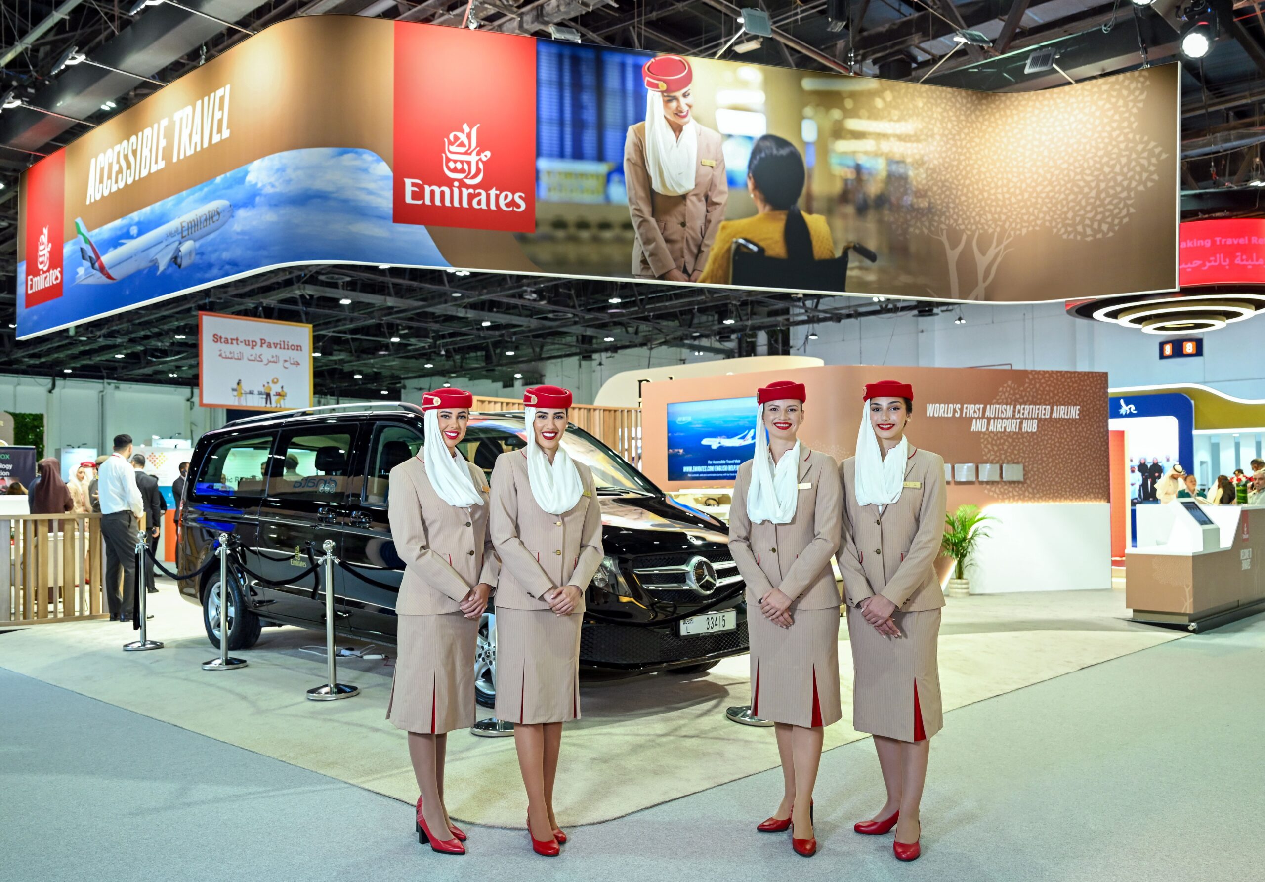 Female Emirates Cabin Crew in front of Emirates' stand at the AccessAbilities Expo.