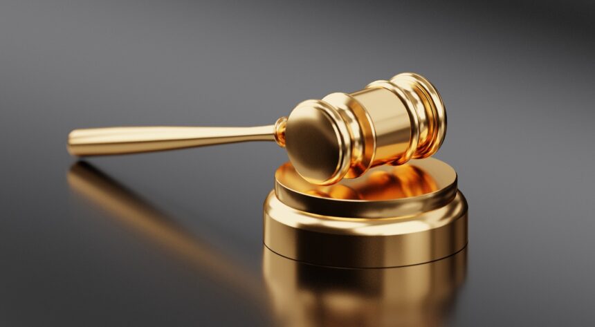A golden judge’s gavel symbolising the Senate aviation safety vote on bipartisan aviation safety legislation and military aircraft airspace rules.