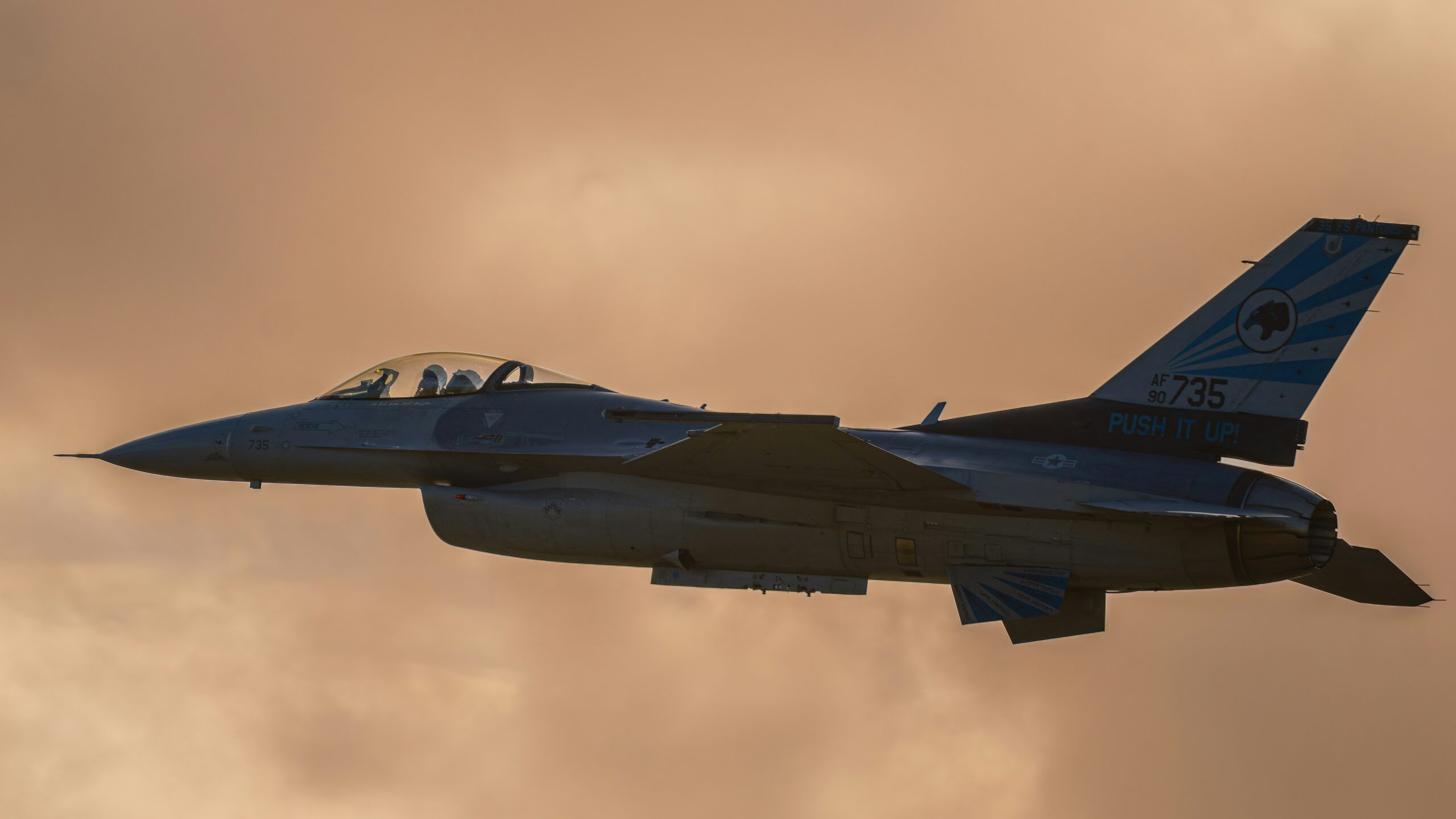 F-16 Fighter Jet in Cloudy Skies 