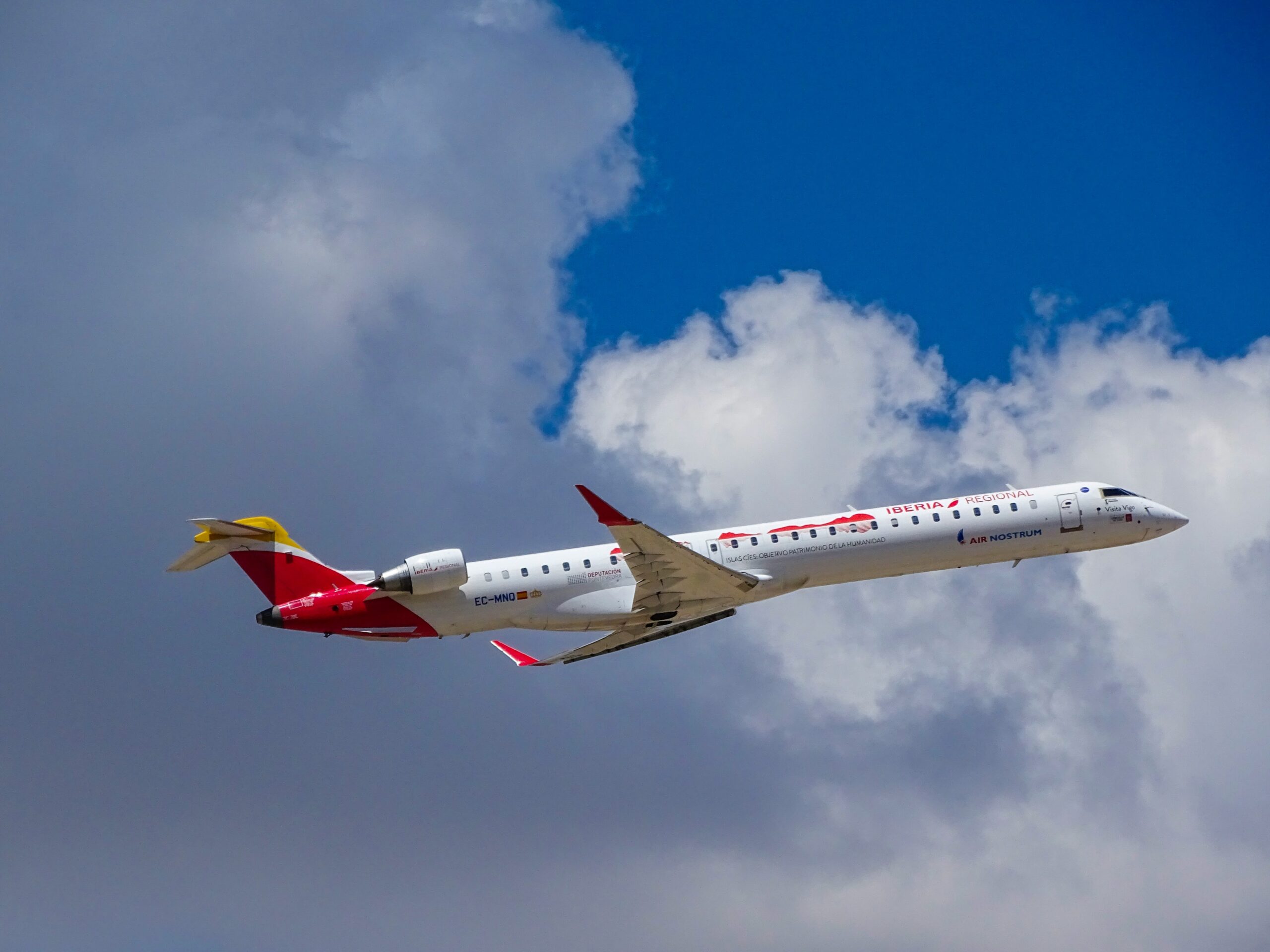 An Iberia Air plane in the sky.