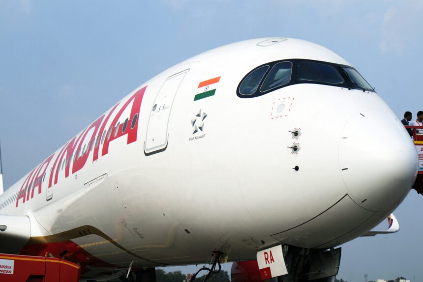 Large Air India jetliner sitting on airport tarmac