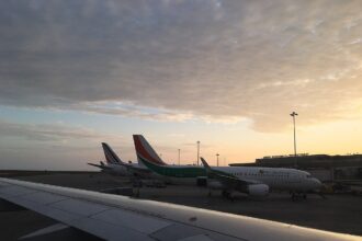 Air Côte d'Ivoire planes in sillouette at sunset.