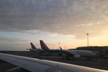 Air Côte d'Ivoire planes in sillouette at sunset.