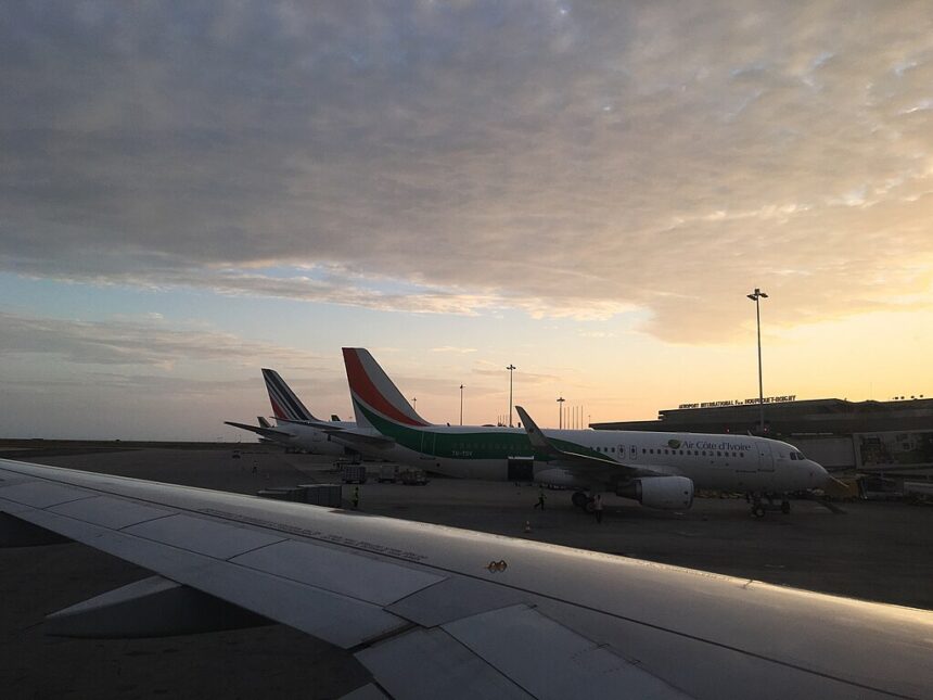 Air Côte d'Ivoire planes in sillouette at sunset.