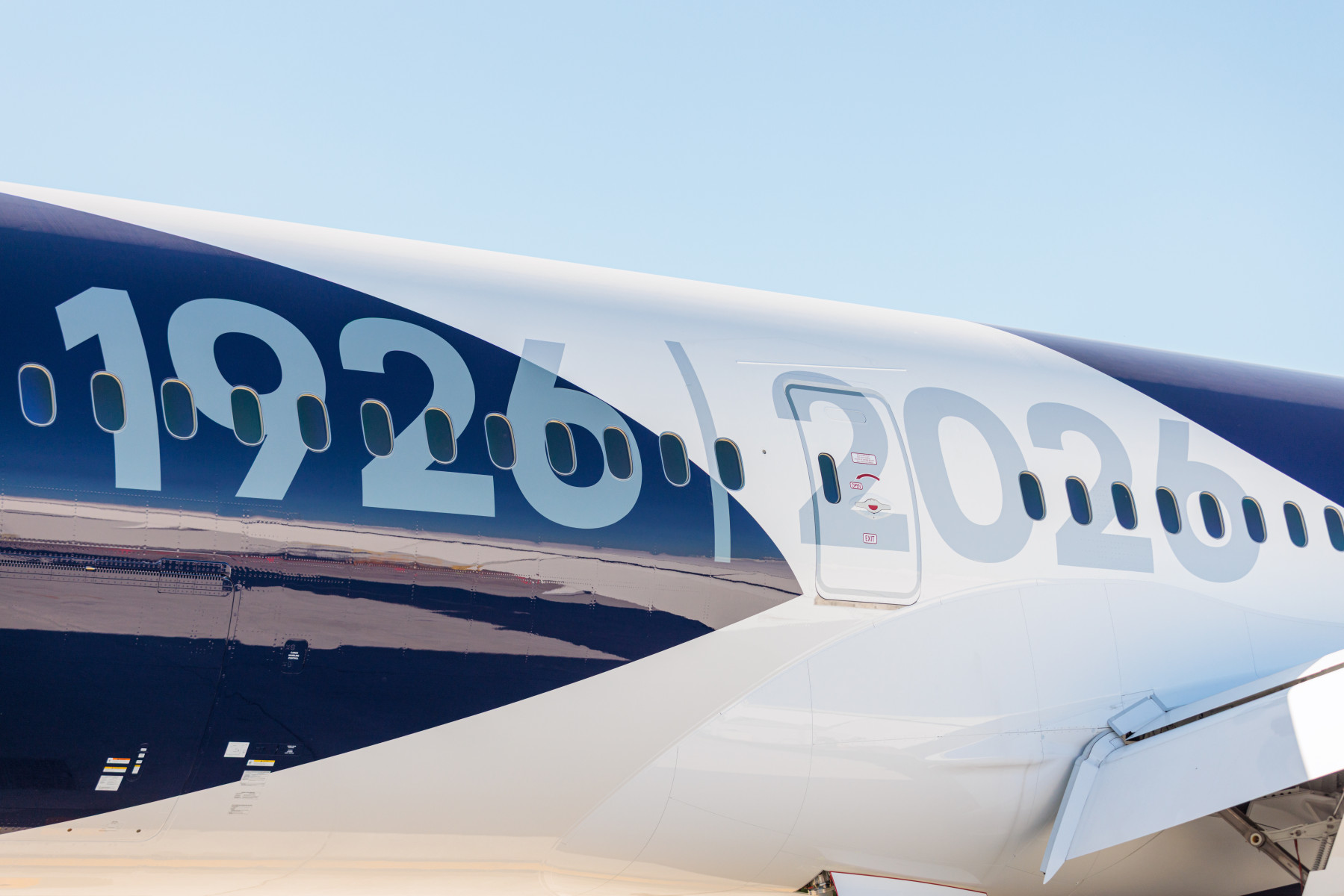 The side of the Lufthansa aircraft, showing the numbers 1926 and 2026.