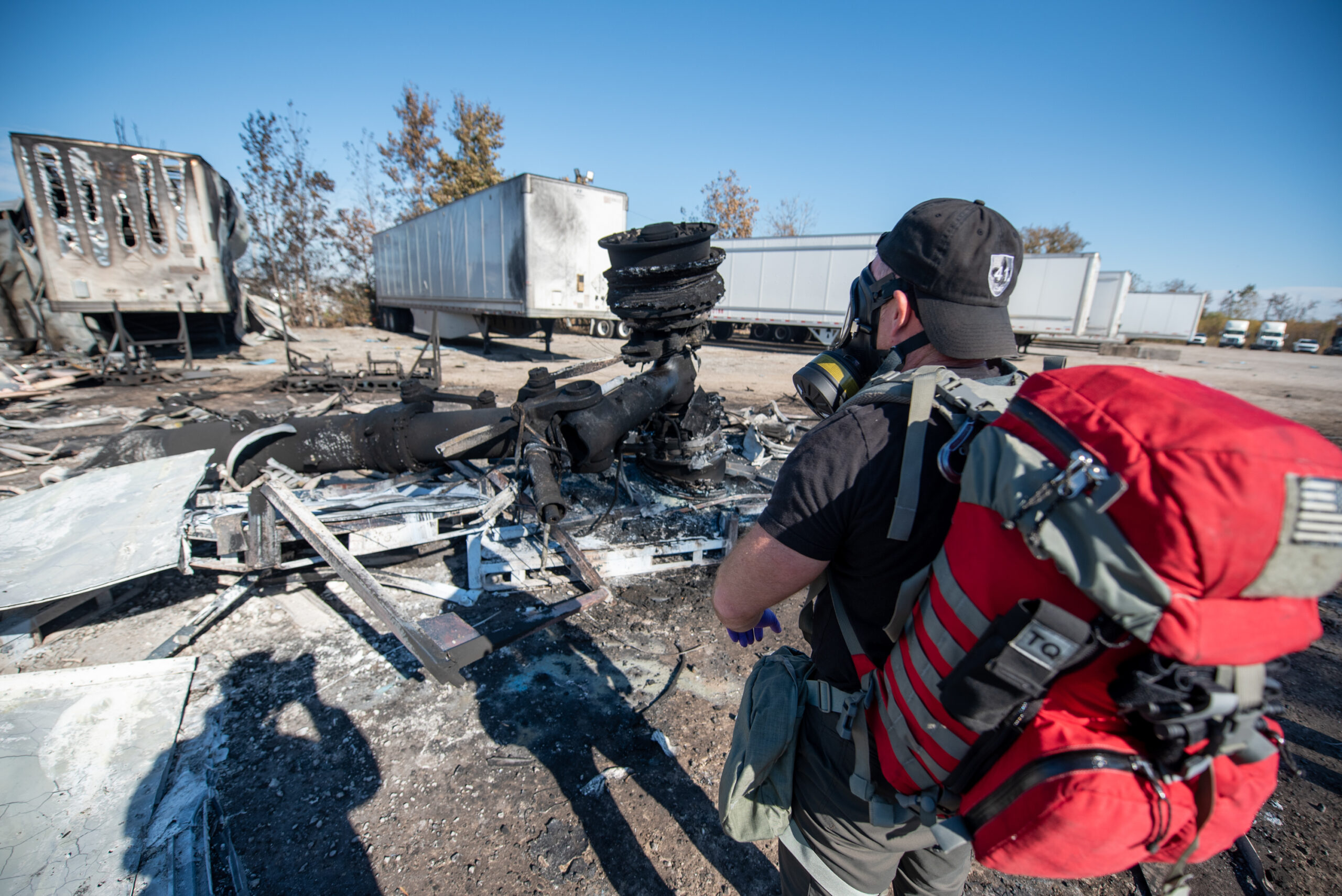 Members of the Kentucky National Guard’s 41st Civil Support Team survey the site of a fatal civilian airplane crash in Louisville