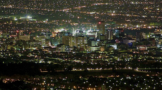 Adelaide city centre at night from above.