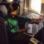 A passenger enjoying Wi-Fi connection in the British AIrways Club World cabin.