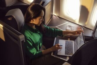 A passenger enjoying Wi-Fi connection in the British AIrways Club World cabin.
