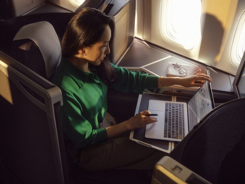 A passenger enjoying Wi-Fi connection in the British AIrways Club World cabin.