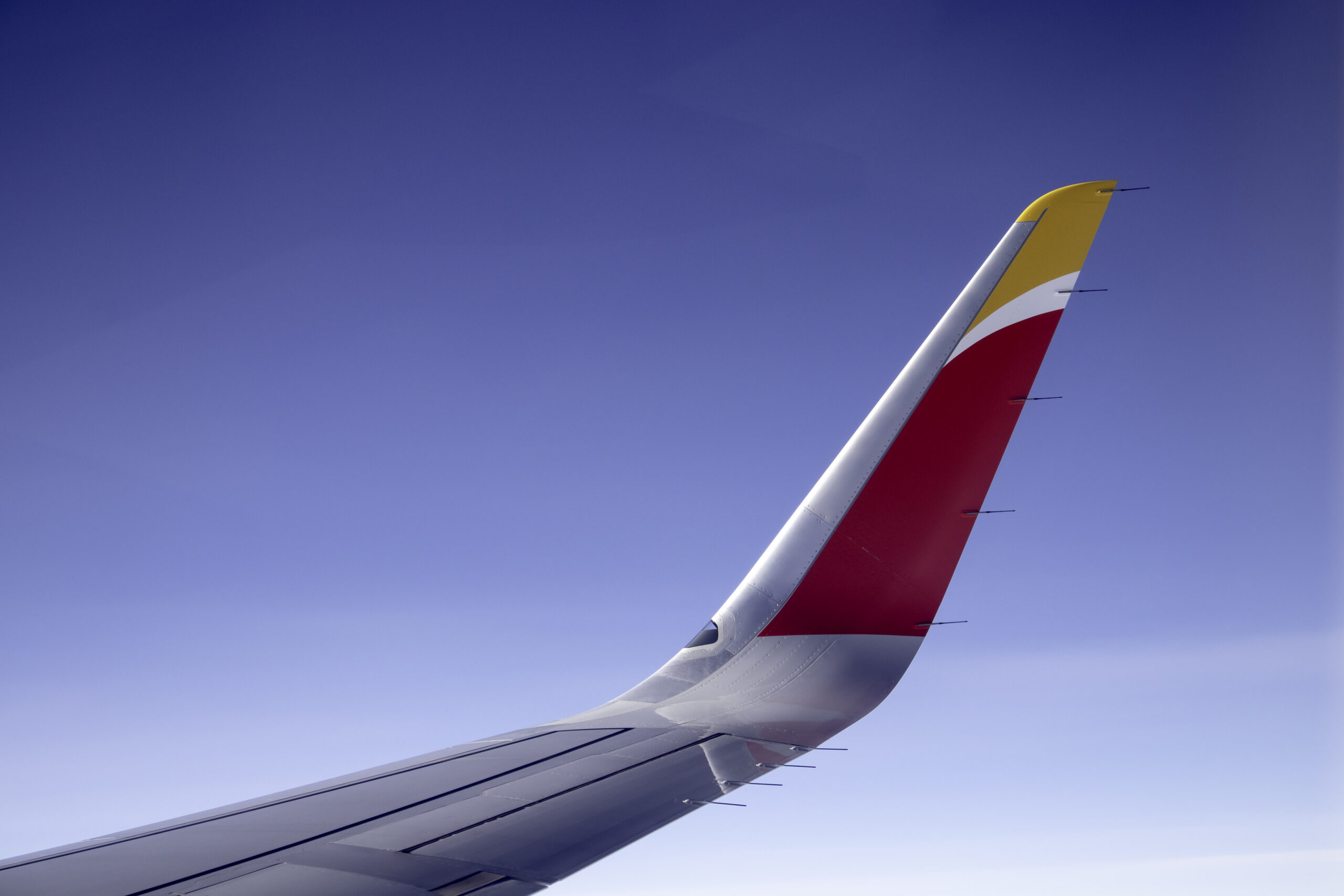 An Iberia aircraft wing above the crowd.